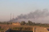 انبار مهمات الحشد الشعبی عراق هدف بمباران هوایی قرار گرفت .
